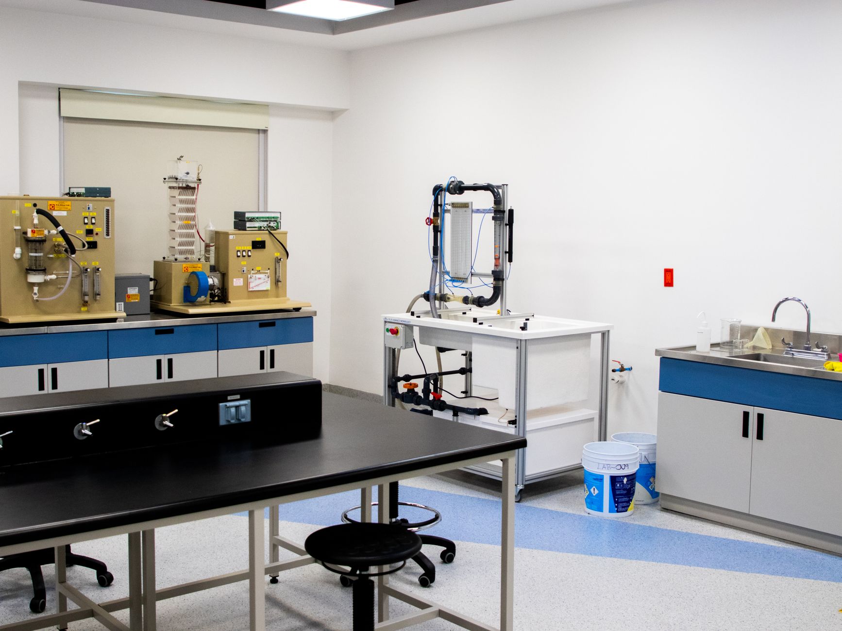 Triaxial test apparatus in a geotechnical laboratory measuring shear strength of soil sample