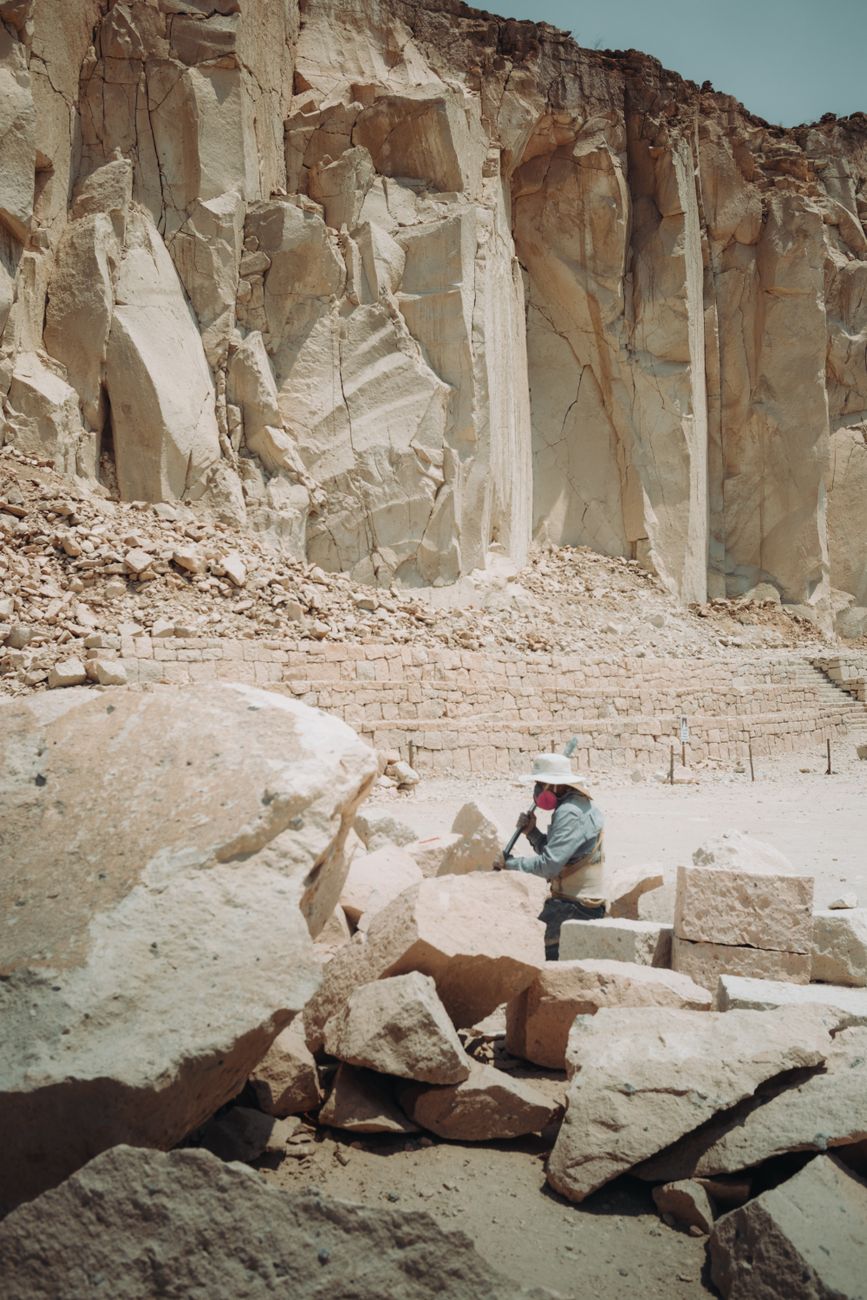 Rock face inspection in a quarry showing exposed discontinuities and structural features for geological assessment