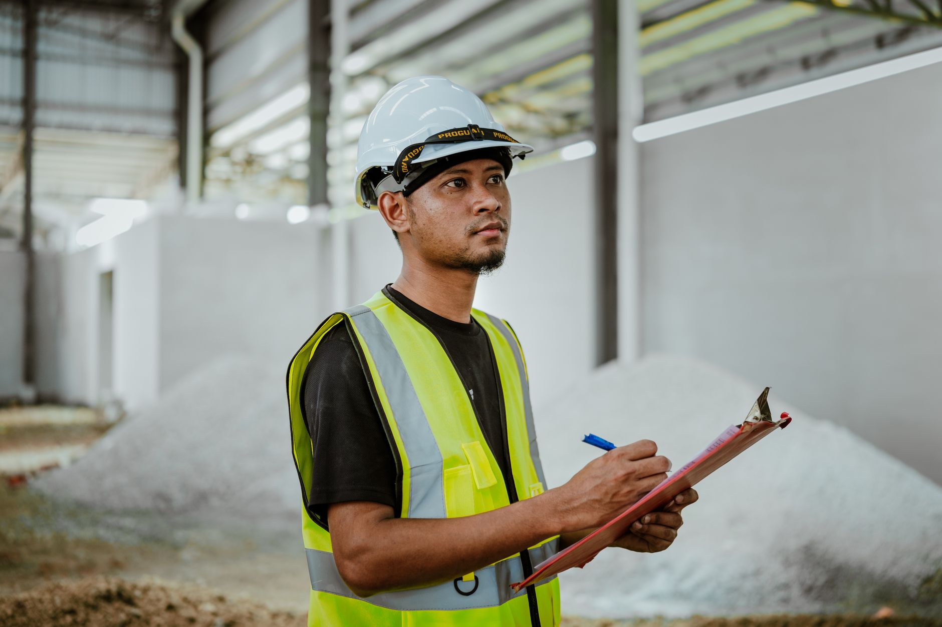 Site engineer carrying out an independent quality assurance inspection