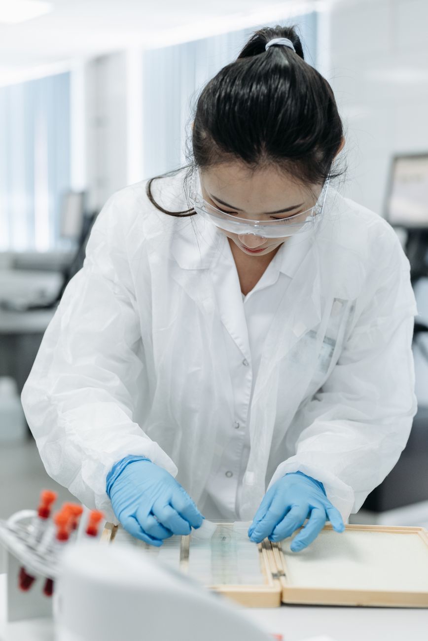 Laboratory technician carrying out index testing on a soil sample